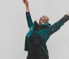 woman celebrating with confetti