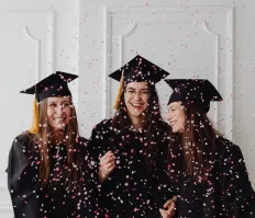 Graduating students with confetti