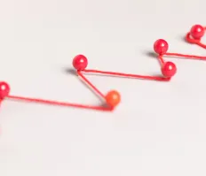 Pins connected by threads