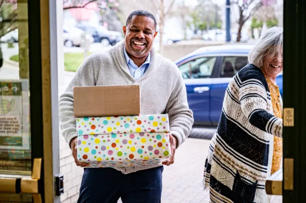 Volunteer holding boxes