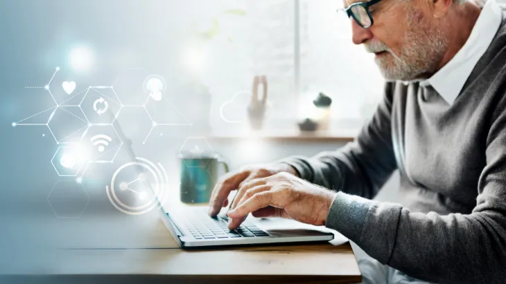 Man using computer with icons