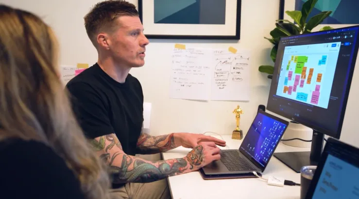 Matt and Mahya working on a computer