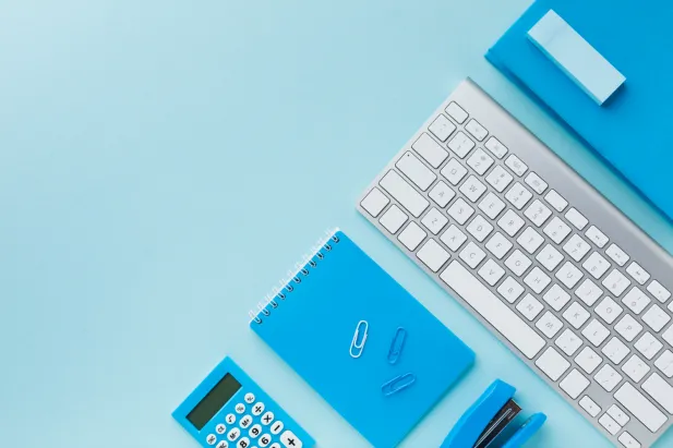 flat lay of keyboard and notepad