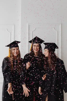 Graduating students with confetti