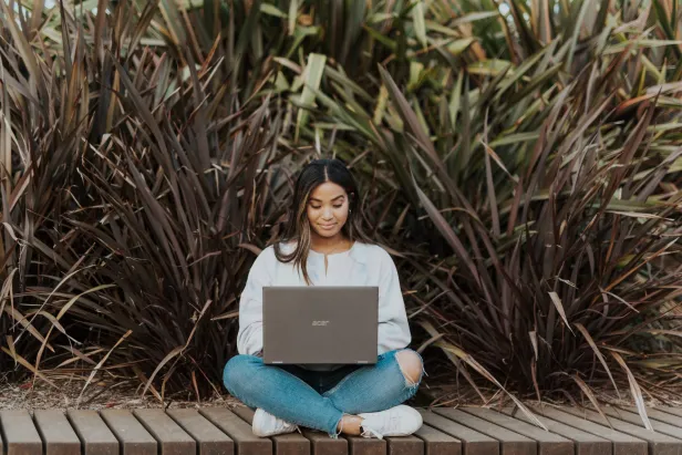 student looking at laptop
