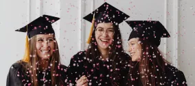 Graduating students with confetti