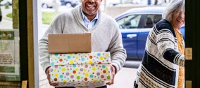 Volunteer holding boxes
