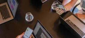 group of workers using devices