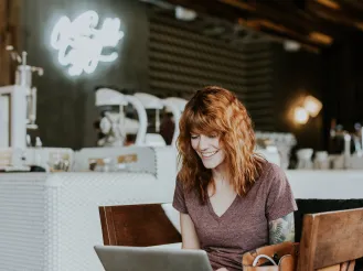 woman working in a cafe on a laptop