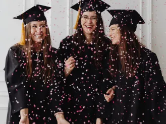 Graduating students with confetti