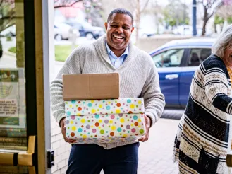Volunteer holding boxes