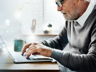 Man using computer with icons