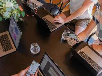 group of workers using devices