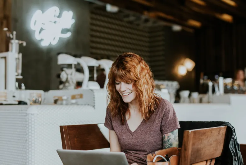 woman working in a cafe on a laptop