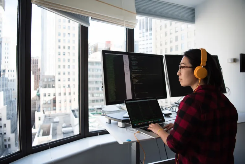 Web developer working on a computer