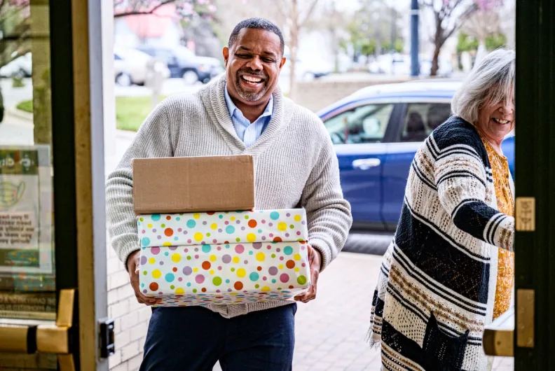 Volunteer holding boxes