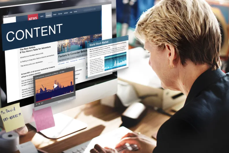Woman looking at content on desktop computer