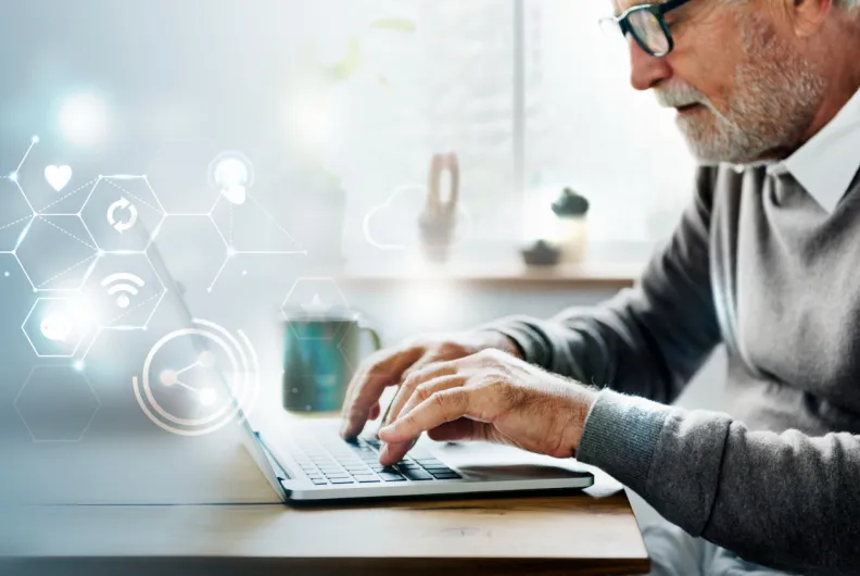 Man using computer with icons