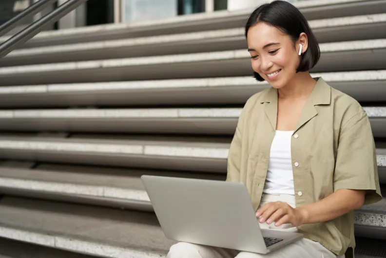 student looking at laptop