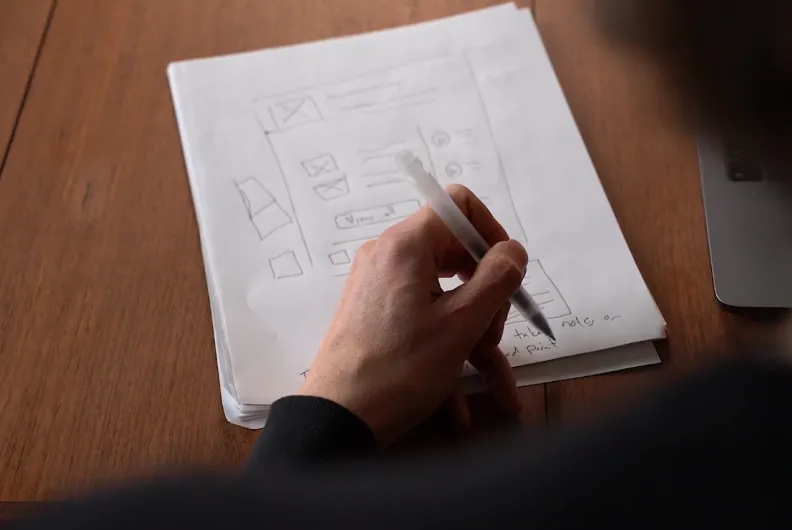 Person drawing on paper