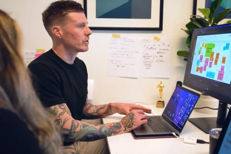 Matt and Mahya working on a computer