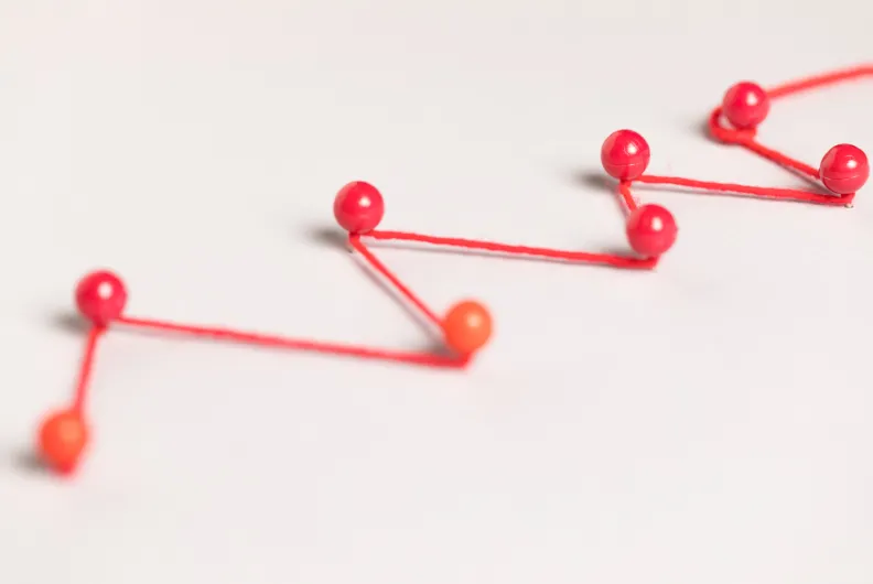 Pins connected by threads