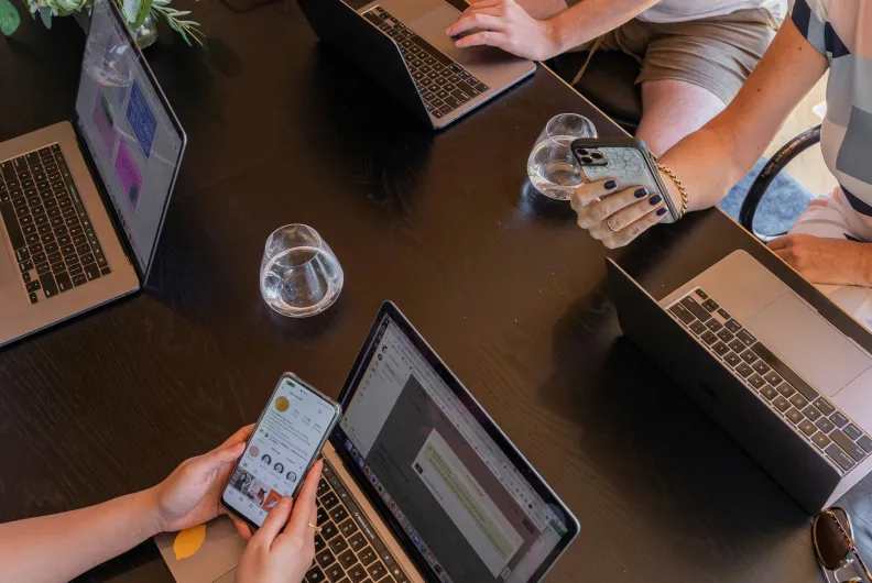 group of workers using devices